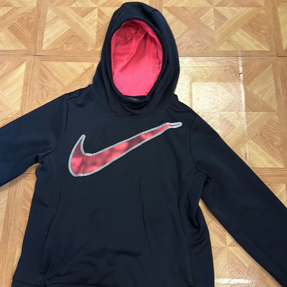 This is a kids medium Nike hoodie No tags and is worn. Has a silky soft material